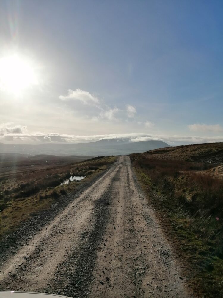 Ingleborough shrouded in low cloud, taken from the road to Greenfield Forest.